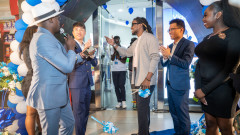 TECNO team led by CAMON 20 Brand Ambassador, Nyashinski cut a ribbon to commemorate the official opening of the new TECNO Exclusive Store at the Garden City Mall. PHOTO/TECNO